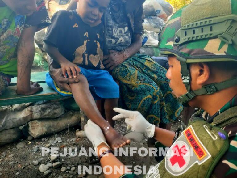 Senyuman Walesi Satgas Yonif 521/DY di Pos TNI Distrik Walesi